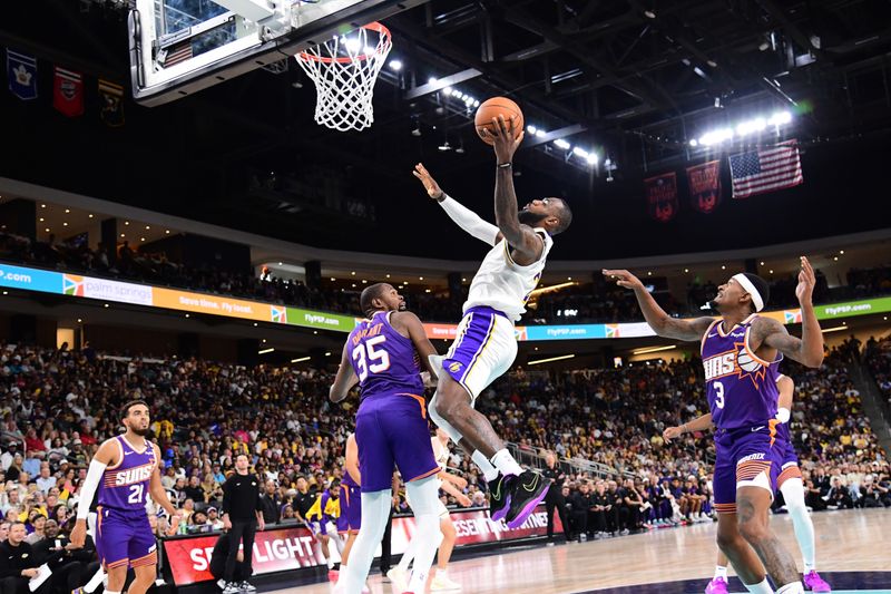 LOS ANGELES, CA - OCTOBER 6: LeBron James #23 of the Los Angeles Lakers drives to the basket during the game against the Phoenix Suns on October 6, 2024 at Acrisure Arena in Palm Springs, California. NOTE TO USER: User expressly acknowledges and agrees that, by downloading and/or using this Photograph, user is consenting to the terms and conditions of the Getty Images License Agreement. Mandatory Copyright Notice: Copyright 2024 NBAE (Photo by Adam Pantozzi/NBAE via Getty Images)