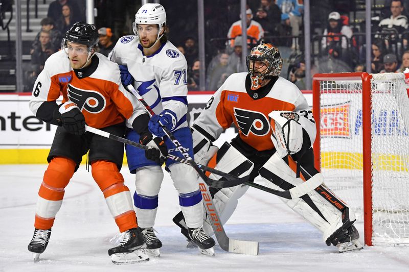 Feb 27, 2024; Philadelphia, Pennsylvania, USA; Tampa Bay Lightning center Anthony Cirelli (71) and Philadelphia Flyers defenseman Travis Sanheim (6) battle for position in front of goaltender Samuel Ersson (33) during the second period at Wells Fargo Center. Mandatory Credit: Eric Hartline-USA TODAY Sports