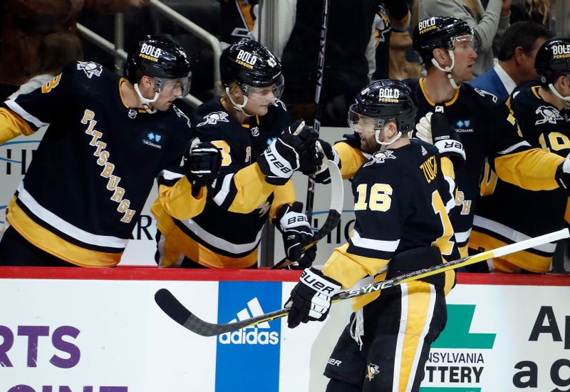 Apr 6, 2023; Pittsburgh, Pennsylvania, USA; Pittsburgh Penguins left wing Jason Zucker (16) celebrates his goal with the Pens bench against the Minnesota Wild during the third period at PPG Paints Arena. Pittsburgh won 4-1.Mandatory Credit: Charles LeClaire-USA TODAY Sports