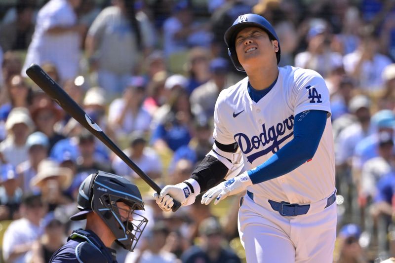 Aug 25, 2024; Los Angeles, California, USA;   Los Angeles Dodgers designated hitter Shohei Ohtani (17) reacts after fouling a ball off his foot in the eighth inning against the Tampa Bay Rays at Dodger Stadium. Mandatory Credit: Jayne Kamin-Oncea-USA TODAY Sports