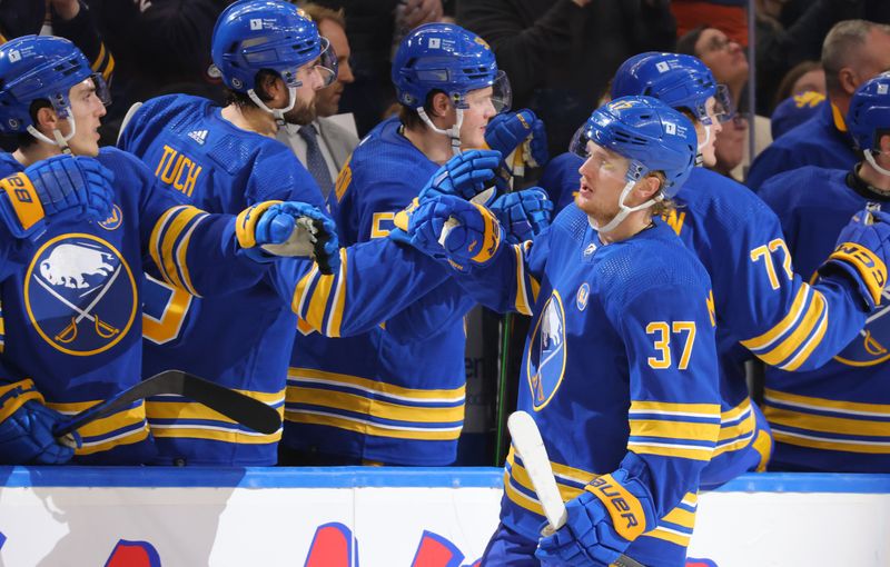 Dec 30, 2023; Buffalo, New York, USA;  Buffalo Sabres center Casey Mittelstadt (37) celebrates his goal with teammates during the third period against the Columbus Blue Jackets at KeyBank Center. Mandatory Credit: Timothy T. Ludwig-USA TODAY Sports