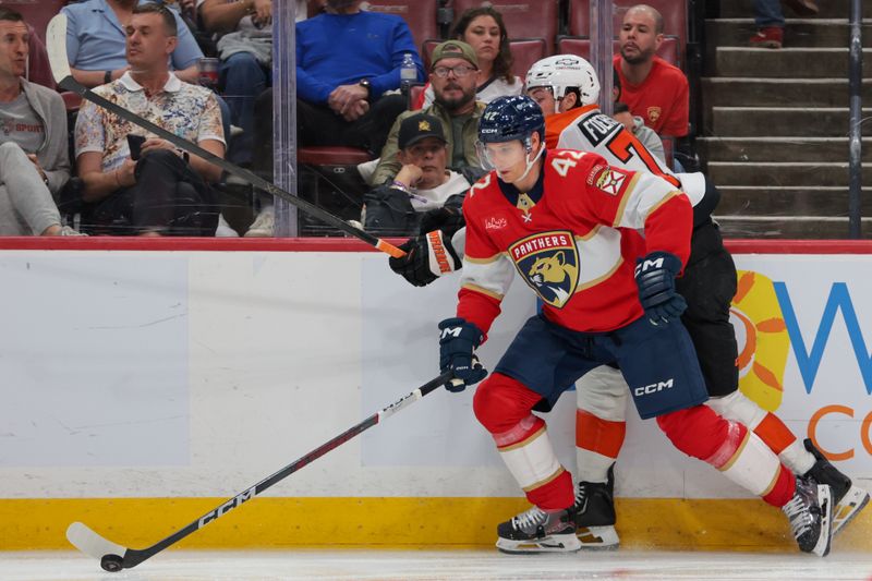Oct 9, 2025; Sunrise, Florida, USA; Florida Panthers defenseman Gustav Forsling (42) moves the puck against Philadelphia Flyers right wing Tyson Foerster (71) during the third period at Amerant Bank Arena. Mandatory Credit: Sam Navarro-Imagn Images