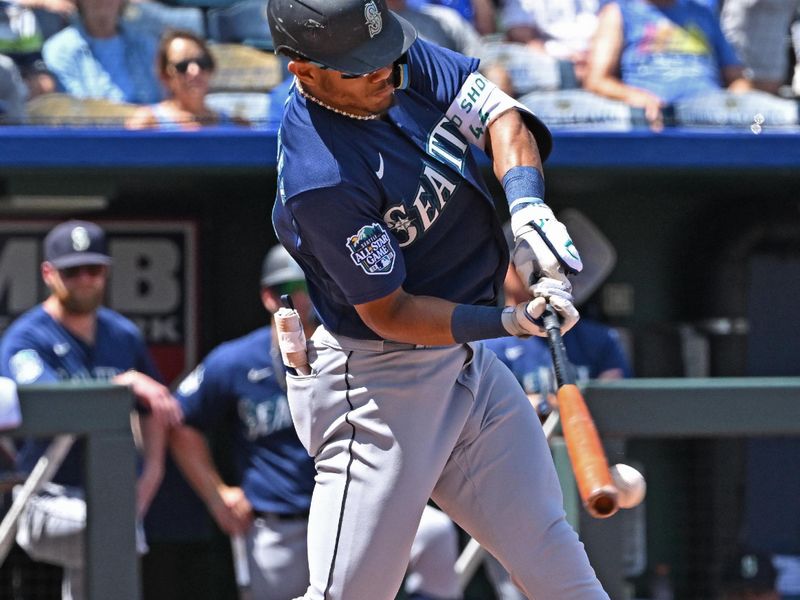 Aug 17, 2023; Kansas City, Missouri, USA;  Seattle Mariners center fielder Julio Rodriguez (44) singles in the fourth inning against the Kansas City Royals at Kauffman Stadium. Mandatory Credit: Peter Aiken-USA TODAY Sports