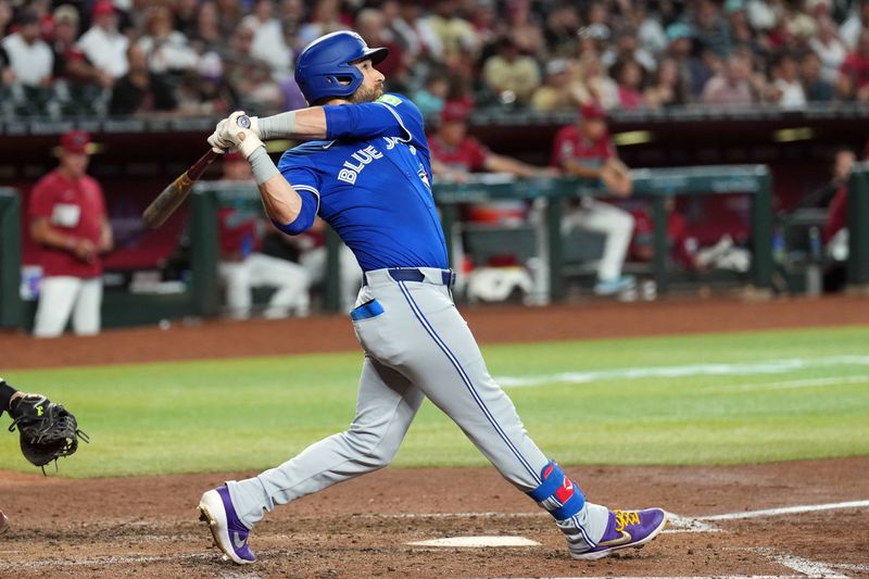 Jul 14, 2024; Phoenix, Arizona, USA; Toronto Blue Jays outfielder Kevin Kiermaier (39) hits a grand slam home run against the Arizona Diamondbacks during the fourth inning at Chase Field. Mandatory Credit: Joe Camporeale-USA TODAY Sports