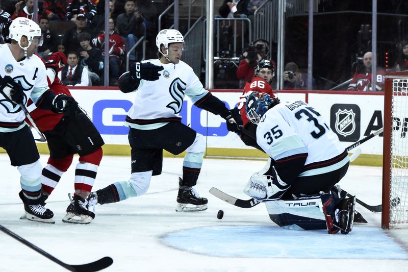 Feb 12, 2024; Newark, New Jersey, USA; Seattle Kraken goaltender Joey Daccord (35) makes a save against the New Jersey Devils during the second period at Prudential Center. Mandatory Credit: John Jones-USA TODAY Sports