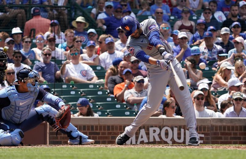 Jun 21, 2024; Chicago, Illinois, USA; New York Mets designated hitter J.D. Martinez (28) hits a one run single against the Chicago Cubs during the fourth inning at Wrigley Field. Mandatory Credit: David Banks-USA TODAY Sports