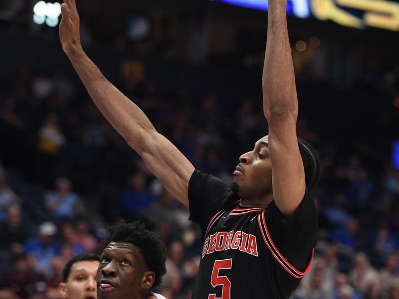 Mar 14, 2024; Nashville, TN, USA; Florida Gators forward Tyrese Samuel (4) attempts a shot as he is defended by Georgia Bulldogs center Frank Anselem-Ibe (5) during the first half at Bridgestone Arena. Mandatory Credit: Christopher Hanewinckel-USA TODAY Sports