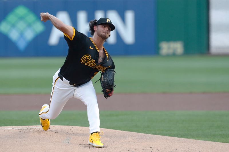 Aug 27, 2024; Pittsburgh, Pennsylvania, USA;  Pittsburgh Pirates starting pitcher Jared Jones (37) delivers a pitch against the Chicago Cubs during the first inning at PNC Park. Mandatory Credit: Charles LeClaire-USA TODAY Sports