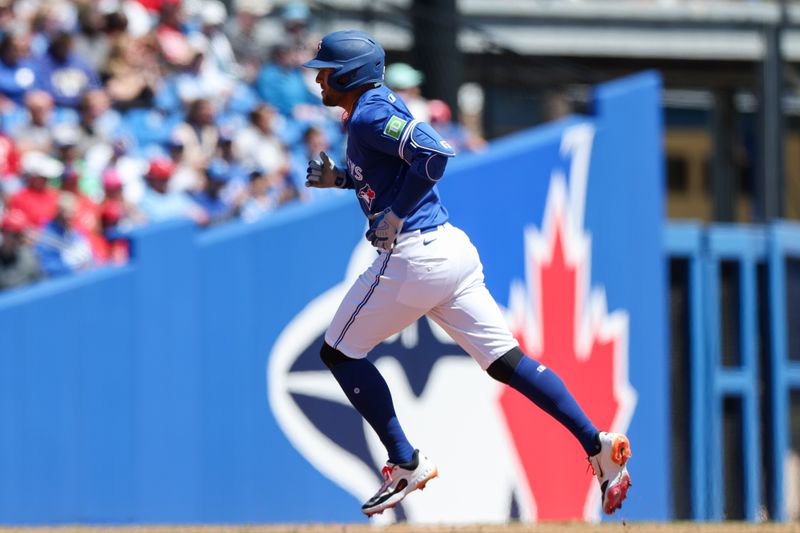 Mar 21, 2025; Dunedin, Florida, USA; Toronto Blue Jays outfielder George Springer (4) runs the bases after hitting a three run home run against the Philadelphia Phillies in the third inning during spring training at TD Ballpark. Mandatory Credit: Nathan Ray Seebeck-Imagn Images