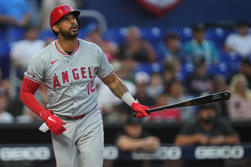 Apr 2, 2024; Miami, Florida, USA; Los Angeles Angels right fielder Aaron Hicks (12) hits a solo home run against the Miami Marlins in the fourth inning at loanDepot Park. Mandatory Credit: Jim Rassol-USA TODAY Sports