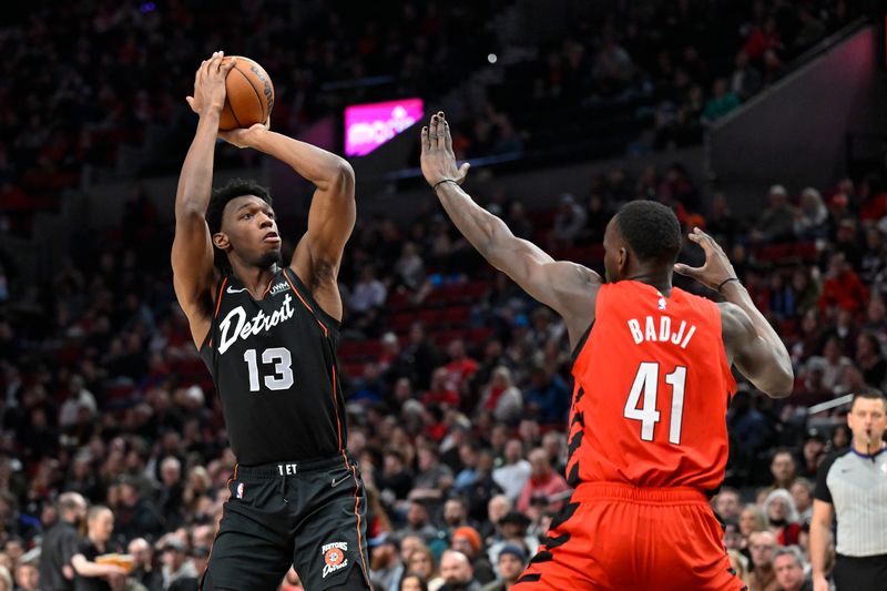 PORTLAND, OREGON - FEBRUARY 08: James Wiseman #13 of the Detroit Pistons shoots over Ibou Badji #41 of the Portland Trail Blazers during the first quarter of the game at the Moda Center on February 08, 2024 in Portland, Oregon. NOTE TO USER: User expressly acknowledges and agrees that, by downloading and or using this photograph, User is consenting to the terms and conditions of the Getty Images License Agreement. (Photo by Alika Jenner/Getty Images)