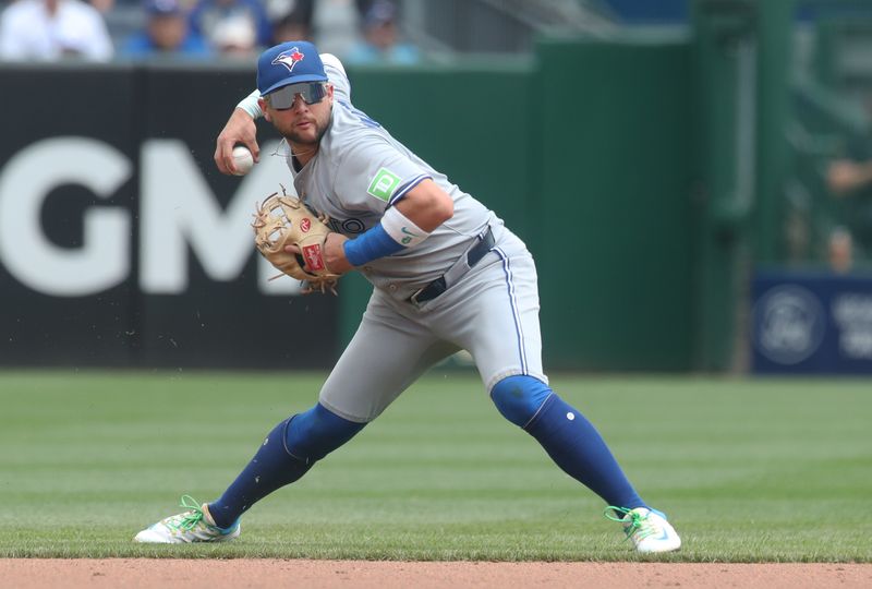 Aug 20, 2025; Pittsburgh, Pennsylvania, USA;  Toronto Blue Jays shortstop Bo Bichette (11) throws to first base against the Pittsburgh Pirates during the fifth inning at PNC Park. Mandatory Credit: Charles LeClaire-Imagn Images