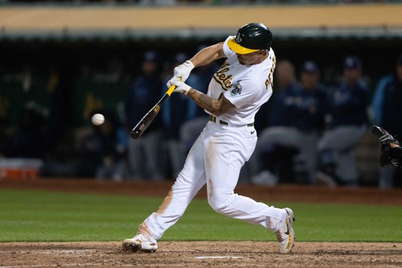 Jun 14, 2023; Oakland, California, USA;  Oakland Athletics third baseman Jace Peterson (6) hits a single during the ninth inning against the Tampa Bay Rays at Oakland-Alameda County Coliseum. Mandatory Credit: Stan Szeto-USA TODAY Sports