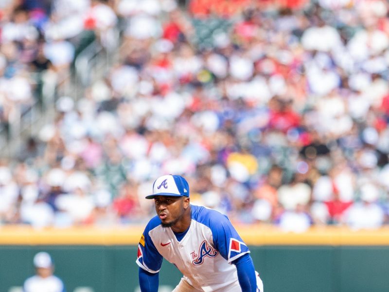 Jun 29, 2024; Cumberland, Georgia, USA; Atlanta Braves second base Ozzie Albies (1) waits for the pitch against the Pittsburgh Pirates during the sixth inning at Truist Park. Mandatory Credit: Jordan Godfree-USA TODAY Sports