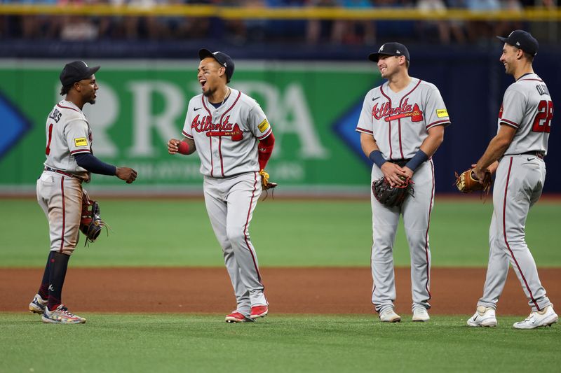 Jul 8, 2023; St. Petersburg, Florida, USA;  Atlanta Braves second baseman Ozzie Albies (1) shortstop Orlando Arcia (11) third baseman Austin Riley (27) and first baseman Matt Olson (28) wait during a pitching change in the eighth inning against the Tampa Bay Rays at Tropicana Field. Mandatory Credit: Nathan Ray Seebeck-USA TODAY Sports