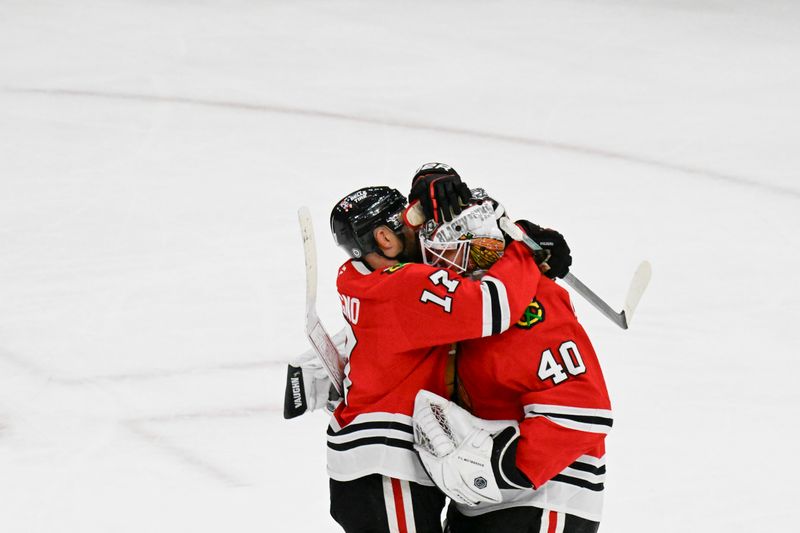 Jan 3, 2025; Chicago, Illinois, USA;  Chicago Blackhawks left wing Nick Foligno (17) hugs Chicago Blackhawks goaltender Arvid Soderblom (40) after the third period against the Montreal Canadiens at United Center. Mandatory Credit: Matt Marton-Imagn Images