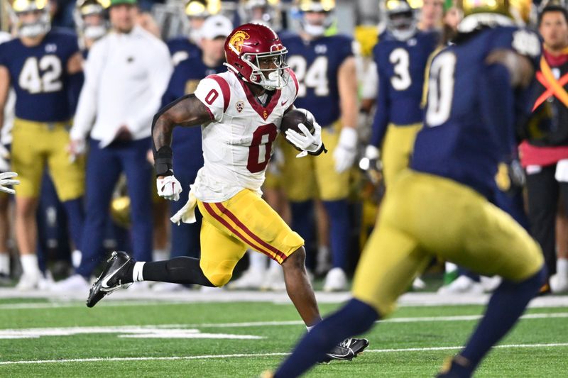 Oct 14, 2023; South Bend, Indiana, USA; USC Trojans running back MarShawn Lloyd (0) runs for a touchdown in the third quarter against the Notre Dame Fighting Irish at Notre Dame Stadium. Mandatory Credit: Matt Cashore-USA TODAY Sports