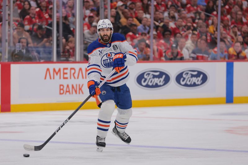 Jun 9, 2025; Sunrise, Florida, USA; Edmonton Oilers defenseman Evan Bouchard (2) controls the puck  during the first period against the Florida Panthers in game three of the 2025 Stanley Cup Final at Amerant Bank Arena. Mandatory Credit: Sam Navarro-Imagn Images