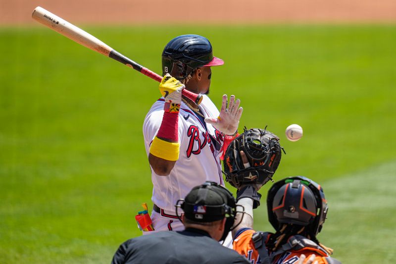 Apr 23, 2023; Cumberland, Georgia, USA; Atlanta Braves right fielder Ronald Acuna Jr. (13) moves out of the way of an inside pitch against the Houston Astros during the first inning at Truist Park. Mandatory Credit: Dale Zanine-USA TODAY Sports