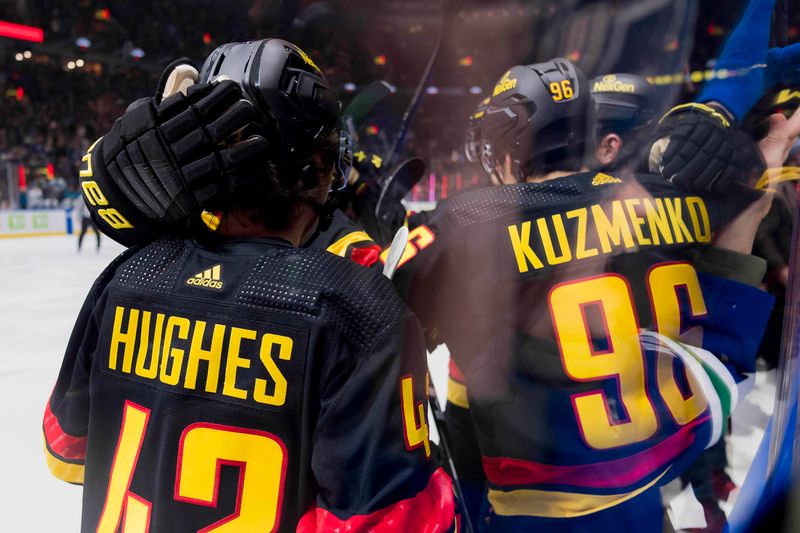 Dec 23, 2023; Vancouver, British Columbia, CAN; Vancouver Canucks defenseman Quinn Hughes (43) and forward Andrei Kuzmenko (96) celebrate Kuzmenko   s first goal of the game against the San Jose Sharks in the first period at Rogers Arena. Mandatory Credit: Bob Frid-USA TODAY Sports