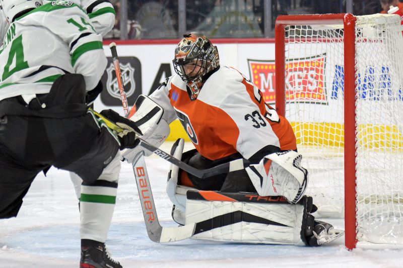 Jan 18, 2024; Philadelphia, Pennsylvania, USA; Philadelphia Flyers goaltender Samuel Ersson (33) battles against the Dallas Stars during the second period at Wells Fargo Center. Mandatory Credit: Eric Hartline-USA TODAY Sports