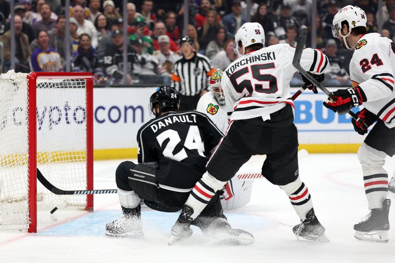 Mar 19, 2024; Los Angeles, California, USA;  Los Angeles Kings center Phillip Danault (24) scores a goal during the third period against the Chicago Blackhawks at Crypto.com Arena. Mandatory Credit: Kiyoshi Mio-USA TODAY Sports