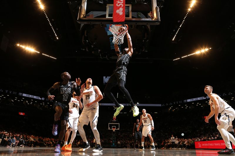 BROOKLYN, NY - OCTOBER 29: Nicolas Claxton #33 of the Brooklyn Nets dunks the ball during the game against the Denver Nuggets on October 29, 2024 at Barclays Center in Brooklyn, New York. NOTE TO USER: User expressly acknowledges and agrees that, by downloading and or using this Photograph, user is consenting to the terms and conditions of the Getty Images License Agreement. Mandatory Copyright Notice: Copyright 2024 NBAE (Photo by Nathaniel S. Butler/NBAE via Getty Images)