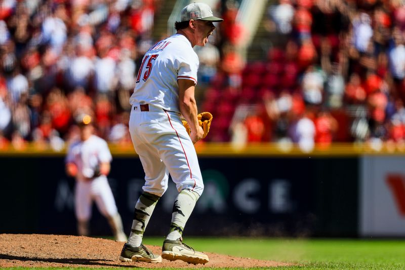 May 18, 2025; Cincinnati, Ohio, USA; Cincinnati Reds relief pitcher Emilio Pagan (15) reacts after the victory over the Cleveland Guardians at Great American Ball Park. Mandatory Credit: Katie Stratman-Imagn Images