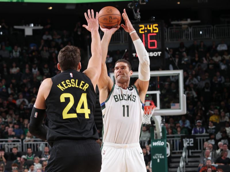 MILWAUKEE, WI - NOVEMBER 7: Brook Lopez #11 of the Milwaukee Bucks shoots a three point basket during the game against the Utah Jazz on November 7, 2024 at Fiserv Forum Center in Milwaukee, Wisconsin. NOTE TO USER: User expressly acknowledges and agrees that, by downloading and or using this Photograph, user is consenting to the terms and conditions of the Getty Images License Agreement. Mandatory Copyright Notice: Copyright 2024 NBAE (Photo by Gary Dineen/NBAE via Getty Images).