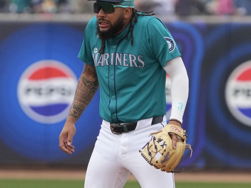 Mar 24, 2024; Peoria, Arizona, USA; Seattle Mariners shortstop J.P. Crawford (3) reacts after a wild pitch against the Chicago Cubs in the third inning at Peoria Sports Complex. Mandatory Credit: Rick Scuteri-USA TODAY Sports