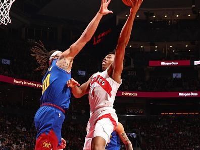 TORONTO, CANADA - DECEMBER 20: Scottie Barnes #4 of the Toronto Raptors drives to the basket during the game against the Denver Nuggets on December 20, 2023 at the Scotiabank Arena in Toronto, Ontario, Canada.  NOTE TO USER: User expressly acknowledges and agrees that, by downloading and or using this Photograph, user is consenting to the terms and conditions of the Getty Images License Agreement.  Mandatory Copyright Notice: Copyright 2023 NBAE (Photo by Vaughn Ridley/NBAE via Getty Images)