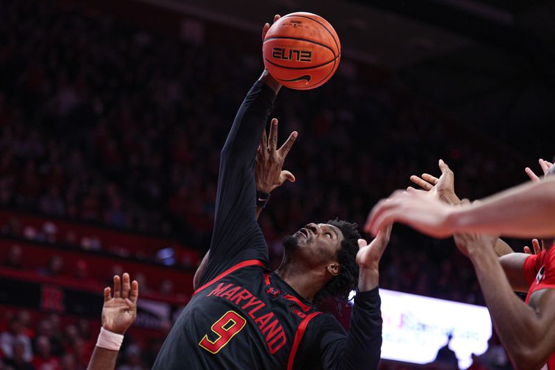 Feb 15, 2026; Piscataway, New Jersey, USA;  Maryland Terrapins forward Solomon Washington (9) rebounds against the Rutgers Scarlet Knights during the second half at Jersey Mike's Arena. Mandatory Credit: Vincent Carchietta-Imagn Images