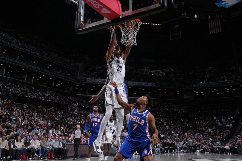 BROOKLYN, NY - MARCH 5: Nicolas Claxton #33 of the Brooklyn Nets dunks the ball during the game against the Philadelphia 76ers on March 5, 2024 at Barclays Center in Brooklyn, New York. NOTE TO USER: User expressly acknowledges and agrees that, by downloading and or using this Photograph, user is consenting to the terms and conditions of the Getty Images License Agreement. Mandatory Copyright Notice: Copyright 2024 NBAE (Photo by Jesse D. Garrabrant/NBAE via Getty Images)