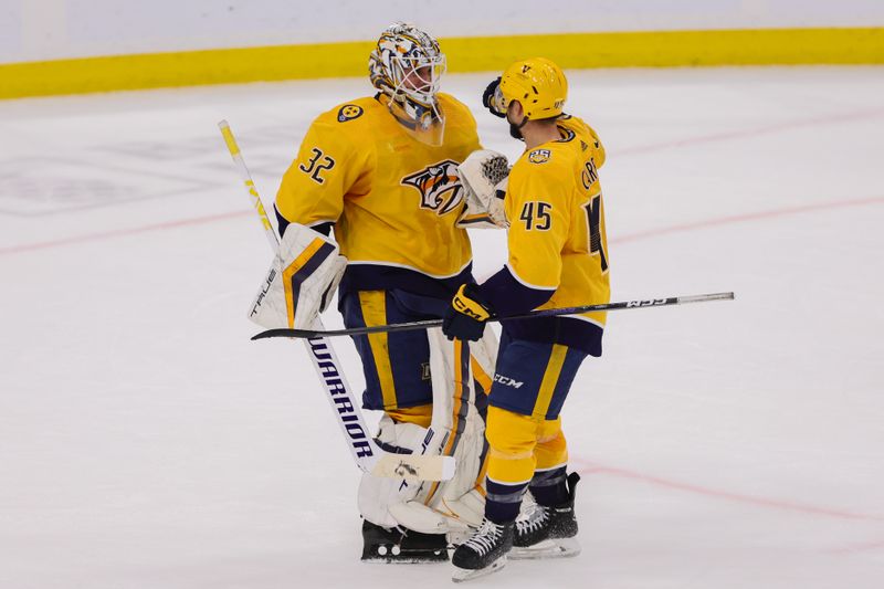 Mar 21, 2024; Sunrise, Florida, USA; Nashville Predators goaltender Kevin Lankinen (32) and defenseman Alexandre Carrier (45) celebrate after the game against the Florida Panthers at Amerant Bank Arena. Mandatory Credit: Sam Navarro-USA TODAY Sports