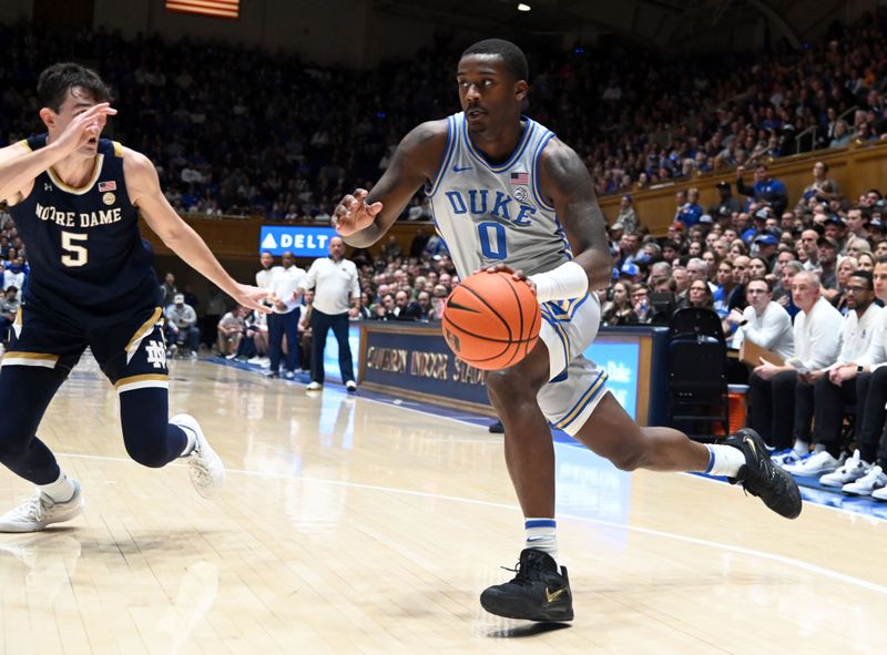 Feb 14, 2023; Durham, North Carolina, USA;  Duke Blue Devils forward Dariq Whitehead(0) drives to the basket as Notre Dame Fighting Irish guard Cormac Ryan (5) defends during the second half at Cameron Indoor Stadium.  The Blue Devils won 68-64. Mandatory Credit: Rob Kinnan-USA TODAY Sports