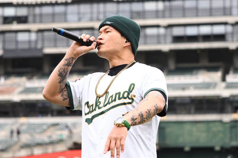 May 25, 2024; Oakland, California, USA; Taiwanese rapper Tseng Kuan-jung professionally known as Dwagio, performs before the game between the Oakland Athletics and Houston Astros at Oakland-Alameda County Coliseum. Mandatory Credit: Kelley L Cox-USA TODAY Sports