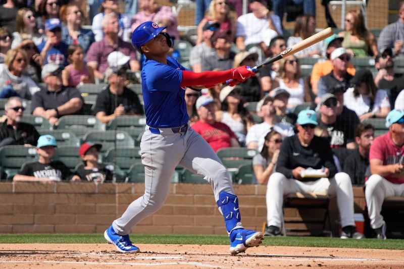 Mar 8, 2024; Salt River Pima-Maricopa, Arizona, USA; Chicago Cubs catcher Miguel Amaya (9) hits against the Arizona Diamondbacks in the second inning at Salt River Fields at Talking Stick. Mandatory Credit: Rick Scuteri-USA TODAY Sports