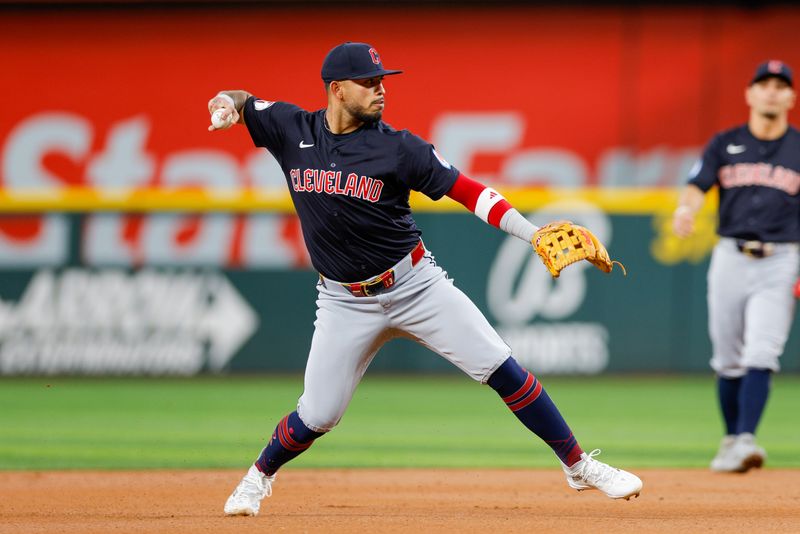 May 15, 2024; Arlington, Texas, USA; Cleveland Guardians third base Gabriel Arias (13) fields a ground ball during the first inning against the Texas Rangers at Globe Life Field. Mandatory Credit: Andrew Dieb-USA TODAY Sports