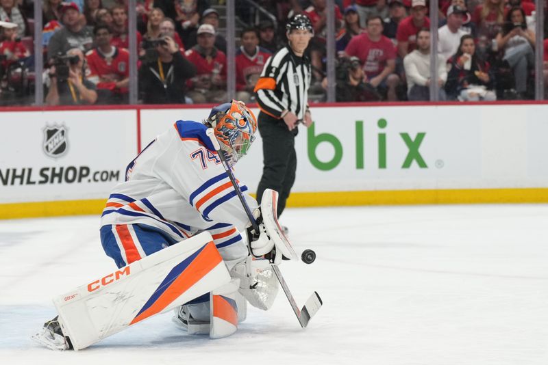Jun 9, 2025; Sunrise, Florida, USA; Edmonton Oilers goaltender Stuart Skinner (74) defend against a shot on net during the second period against the Florida Panthers in game three of the 2025 Stanley Cup Final at Amerant Bank Arena. Mandatory Credit: Jim Rassol-Imagn Images