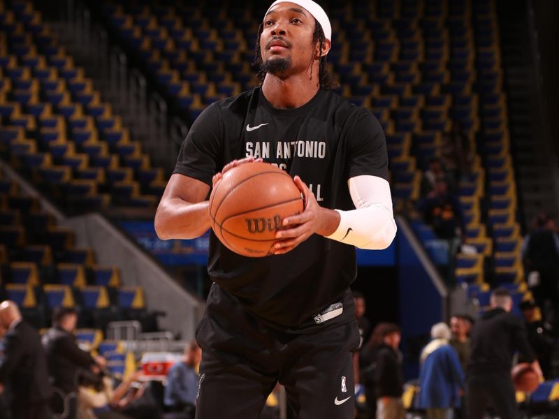 SAN FRANCISCO, CA - MARCH 9: Devonte Graham #4 of the San Antonio Spurs warms up before the game against the Golden State Warriors on March 9, 2024 at Chase Center in San Francisco, California. NOTE TO USER: User expressly acknowledges and agrees that, by downloading and or using this photograph, user is consenting to the terms and conditions of Getty Images License Agreement. Mandatory Copyright Notice: Copyright 2024 NBAE (Photo by Jed Jacobsohn/NBAE via Getty Images)