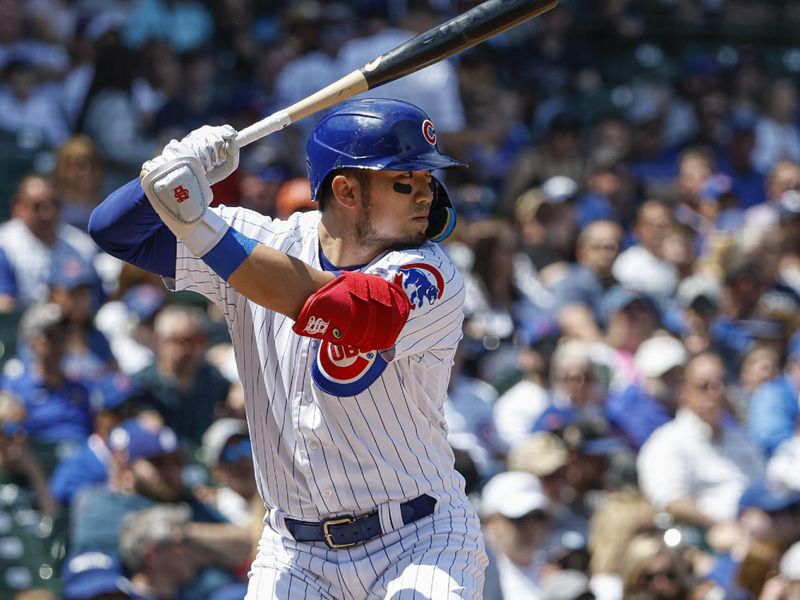 May 5, 2023; Chicago, Illinois, USA; Chicago Cubs right fielder Seiya Suzuki (27) bats against the Miami Marlins during the first inning at Wrigley Field. Mandatory Credit: Kamil Krzaczynski-USA TODAY Sports