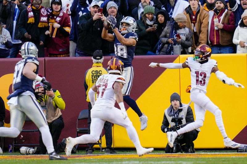 Dallas Cowboys wide receiver Jalen Tolbert (18) catches a touchdown against the Washington Commanders during the first half, Sunday, January 7, 2024, in Landover, Md. Dallas won 38-10. (AP Photo/Jess Rapfogel)