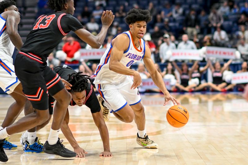 Mar 14, 2024; Nashville, TN, USA;  Florida Gators guard Zyon Pullin (0) dribbles against the Georgia Bulldogs during the second half at Bridgestone Arena. Mandatory Credit: Steve Roberts-USA TODAY Sports