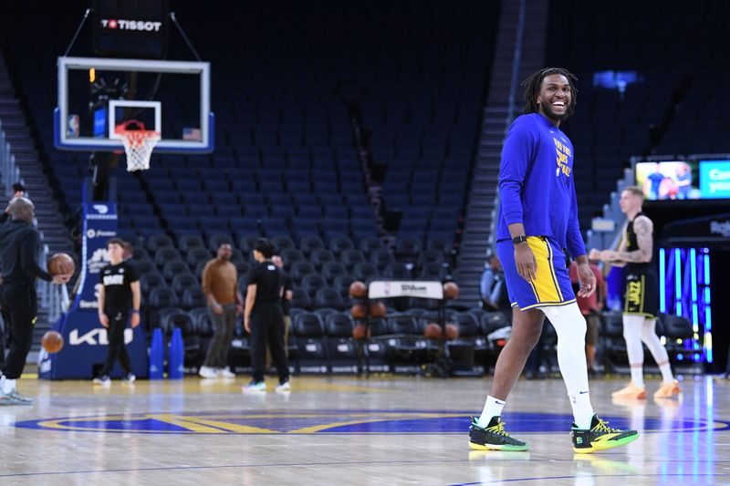 SAN FRANCISCO, CA - APRIL 14: Kevon Looney #5 of the Golden State Warriors smiles before the game against the Utah Jazz on April 14, 2024 at Chase Center in San Francisco, California. NOTE TO USER: User expressly acknowledges and agrees that, by downloading and or using this photograph, user is consenting to the terms and conditions of Getty Images License Agreement. Mandatory Copyright Notice: Copyright 2024 NBAE (Photo by Noah Graham/NBAE via Getty Images)