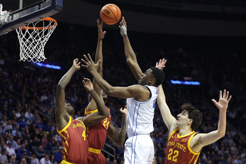 Jan 16, 2024; Provo, Utah, USA; Brigham Young Cougars forward Atiki Ally Atiki (4) shoots against Iowa State Cyclones forward Hason Ward (24) and guard Demarion Watson (4) and forward Milan Momcilovic (22) during the first half at Marriott Center. Mandatory Credit: Rob Gray-USA TODAY Sports