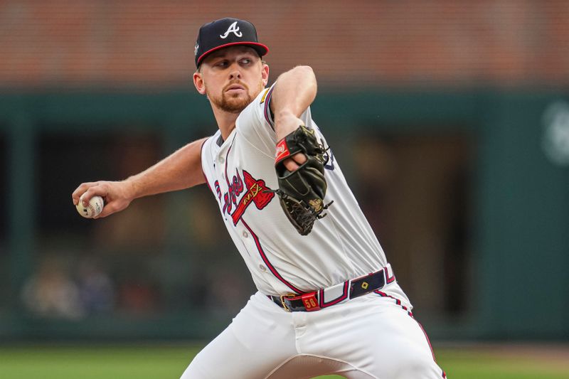 May 13, 2025; Cumberland, Georgia, USA; Atlanta Braves starting pitcher Spencer Schwellenbach (56) pitches against the Washington Nationals during the first inning at Truist Park. Mandatory Credit: Dale Zanine-Imagn Images