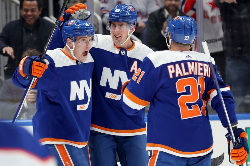 Dec 19, 2023; Elmont, New York, USA; New York Islanders center Bo Horvat (14) celebrates his goal against the Edmonton Oilers with center Brock Nelson (29) and center Kyle Palmieri (21) during the second period at UBS Arena. Mandatory Credit: Brad Penner-USA TODAY Sports