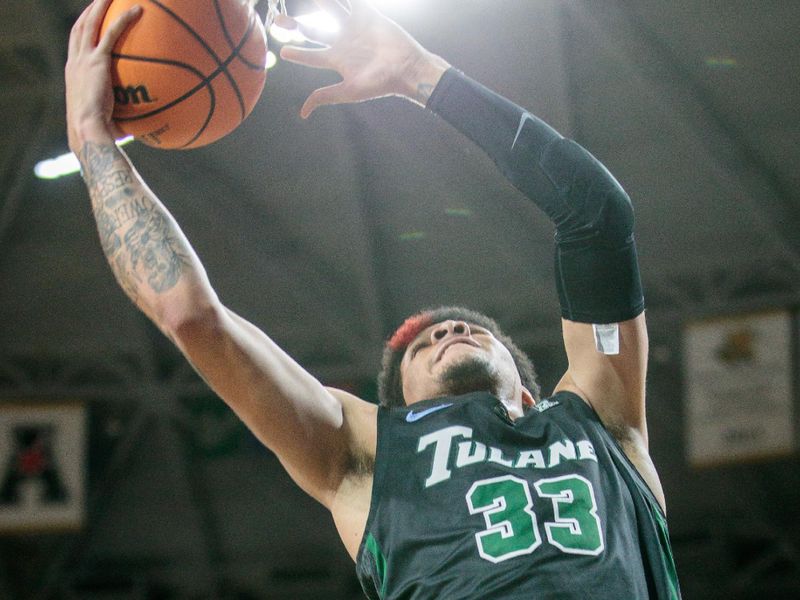 Jan 25, 2023; Wichita, Kansas, USA; Tulane Green Wave forward Tylan Pope (33) puts up a shot during the first half against the Wichita State Shockers at Charles Koch Arena. Mandatory Credit: William Purnell-USA TODAY Sports