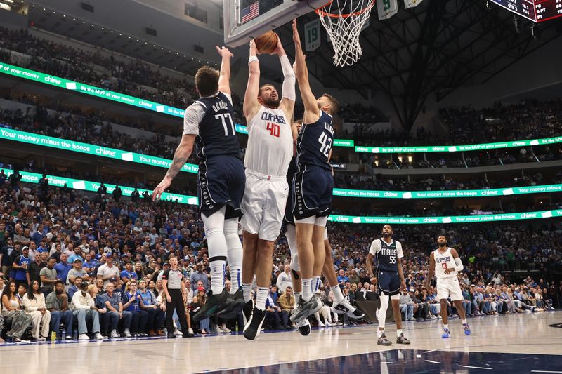 DALLAS, TX - APRIL 28: Ivica Zubac #40 of the LA Clippers shoots the ball during the game against the Dallas Mavericks during Round 1 Game 4 of the 2024 NBA Playoffs on April 28, 2024 at the American Airlines Center in Dallas, Texas. NOTE TO USER: User expressly acknowledges and agrees that, by downloading and or using this photograph, User is consenting to the terms and conditions of the Getty Images License Agreement. Mandatory Copyright Notice: Copyright 2024 NBAE (Photo by Tim Heitman/NBAE via Getty Images)