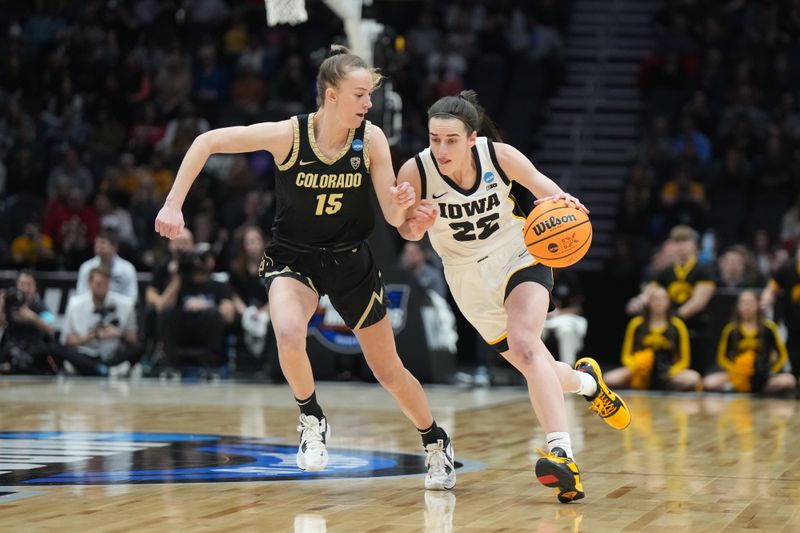 Mar 24, 2023; Seattle, WA, USA; Iowa Hawkeyes guard Caitlin Clark (22) dribbles the ball against Colorado Buffaloes guard Kindyll Wetta (15) in the first half at Climate Pledge Arena. Mandatory Credit: Kirby Lee-USA TODAY Sports